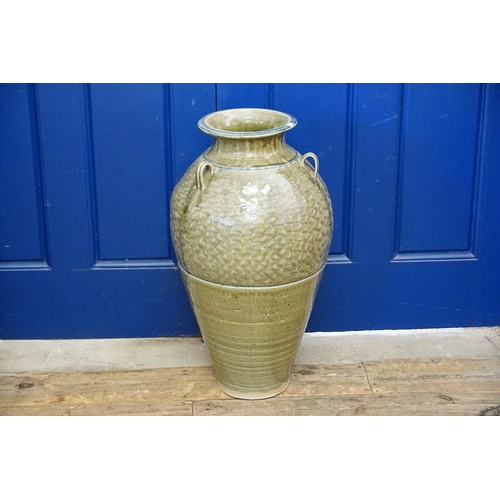 510 - A Celadon Glazed Three Handled Lug Storage Jar. Measuring: 70cms high.