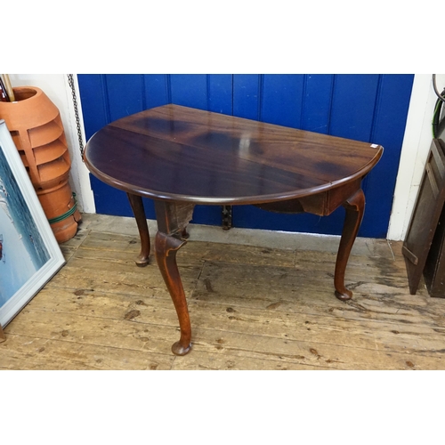 420 - A Georgian Mahogany Oval Top & Drop Flap Dining Room Table resting on a heavy Pad Foot, Pull out & S... 