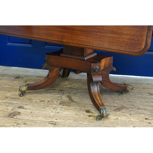 421 - A Victorian Mahogany Drop-Flap Supper Table with ogee decoration resting on a central Tripod Base wi... 