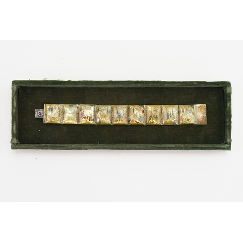 536 - A Silver & Mother of Pearl design Bracelet with painted decoration contained in a case.