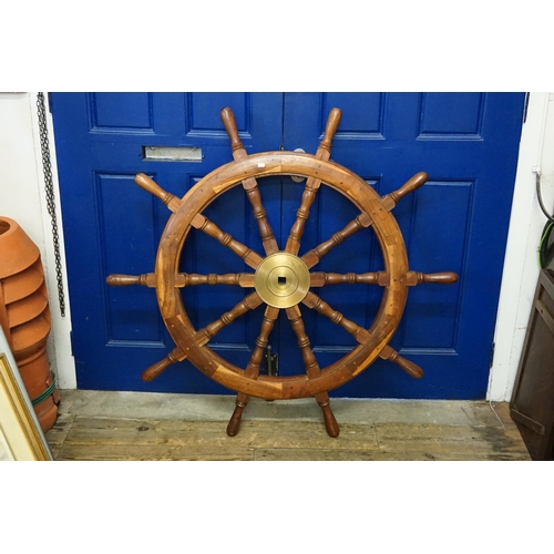 765 - A Teak & Brass mounted Large Ship's Wheel. Measuring: 120cms. (Square bolt. Measuring: 2.8cms).