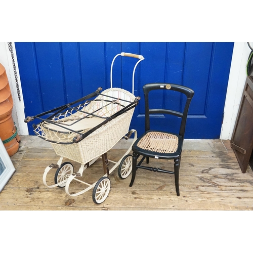 317 - A Wicker Child's Pram with Iron Work Staves and an Ebonised Bedroom Chair.