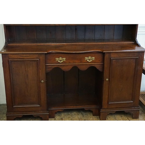 471 - An early 19th Century Mahogany Kitchen Dresser with Cupboards & Drawers. Measuring: 154cms across x ... 