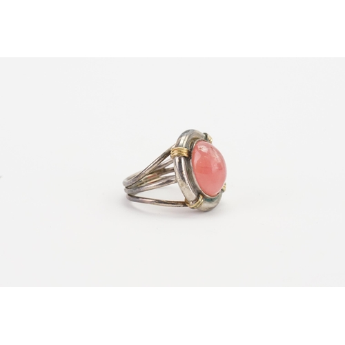 162 - A silver coloured white metal pink stone set ring. Marked 750 & 950. Weight 8.6g. Size L.