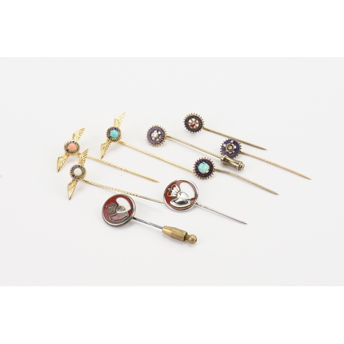 127 - A collection of gold coloured Rotary club stick pins, along with some enamelled, set with opal, diam... 