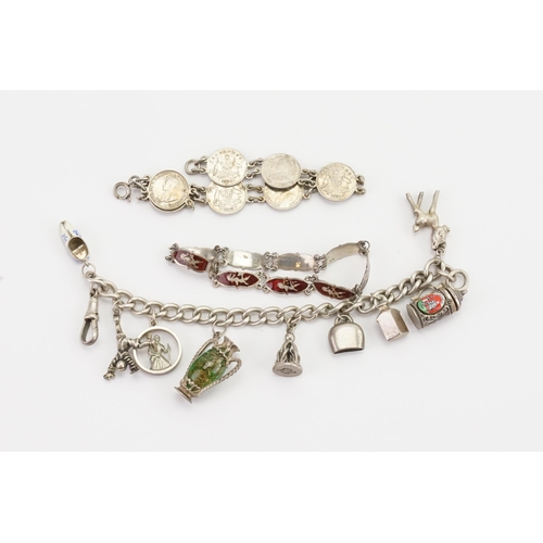 174 - A collection of silver jewellery, to include charm bangle, 1919 coin bracelet etc.