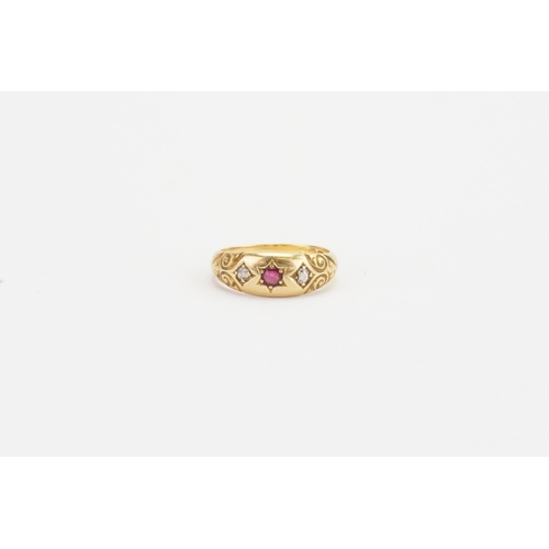 131 - A 18ct diamond and ruby set ring. Weight 3.9g. Size M.