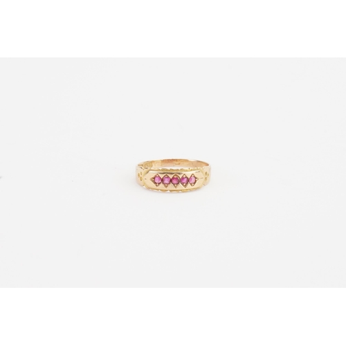 134 - A 15ct gold ruby set ring, set with five rubies. Weight 1.9g. Size M.