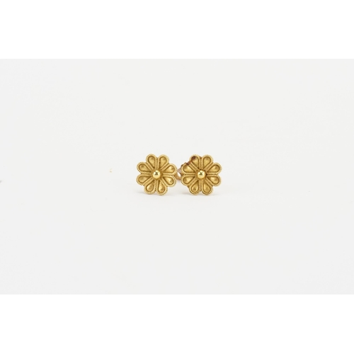 138 - A pair of 18ct gold floral earrings. Weight 1.8g.