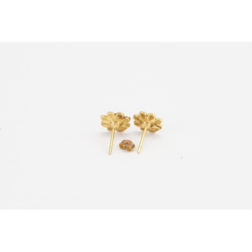 138 - A pair of 18ct gold floral earrings. Weight 1.8g.