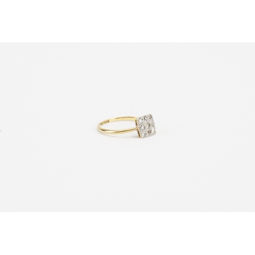 106 - A 18ct gold diamond set ring, in the square formation. Weight 1.4g. Size L.