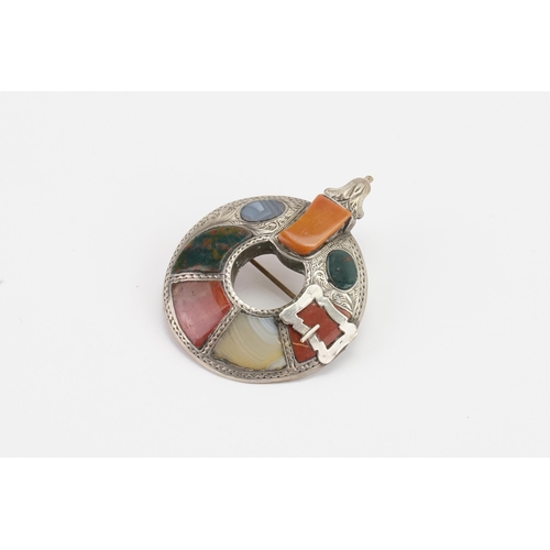 151 - A Scottish pebble brooch, set with blood stone and agate, in the buckle design. Diameter 3.6cm.