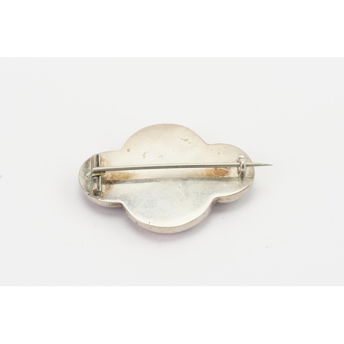 153 - A Scottish pebble brooch, set with various stone. Width 5.1cm.