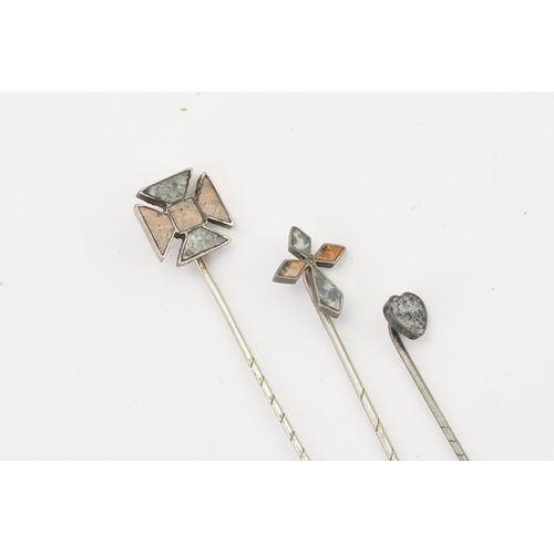 156 - Three Scottish pebble agate set stick pins.