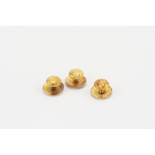 157 - Three 15ct gold dress studs. Weight 2.7g.