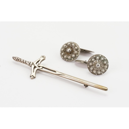 180 - A silver sword brooch, along with a pair of filigree cufflinks.