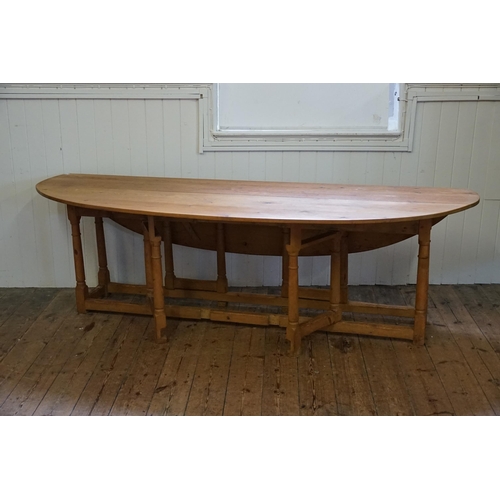 551 - An 19th Century design Irish Pine Wake Table with Fold-Out Bulbous Flaps & Square Cross Stretchers i... 