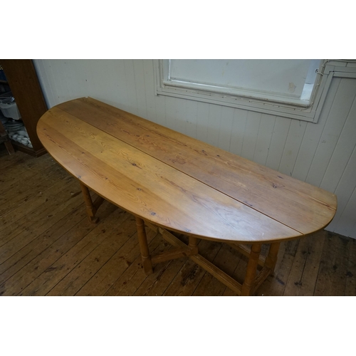 551 - An 19th Century design Irish Pine Wake Table with Fold-Out Bulbous Flaps & Square Cross Stretchers i... 