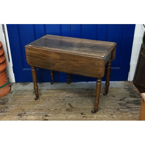 559 - A Victorian Mahogany Drop Flap Pembroke Table standing on turned legs fitted with Single Drawer & Ba... 