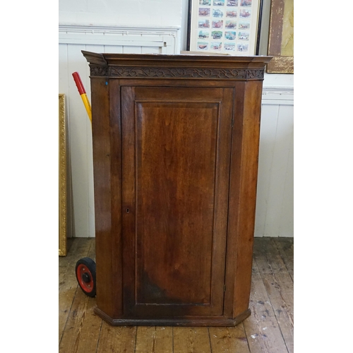 579 - A Victorian Mahogany Corner Cupboard with carved Floreat Top. Measuring: 80cms across x 48cms deep x... 