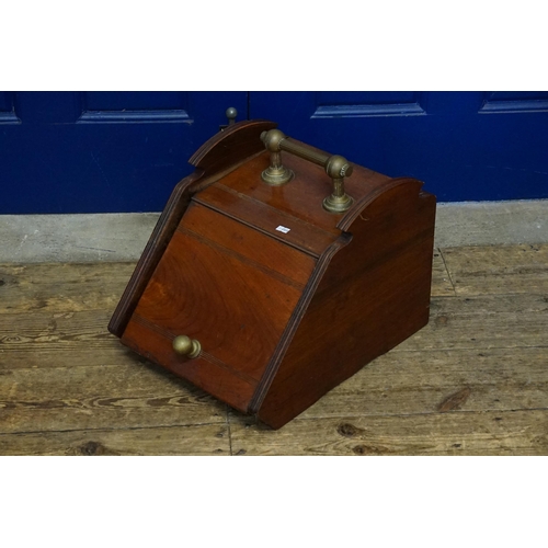 588 - A Victorian Mahogany Coal Scuttle with Brass Handle.