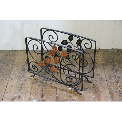 593 - A metal magazine rack with floral design