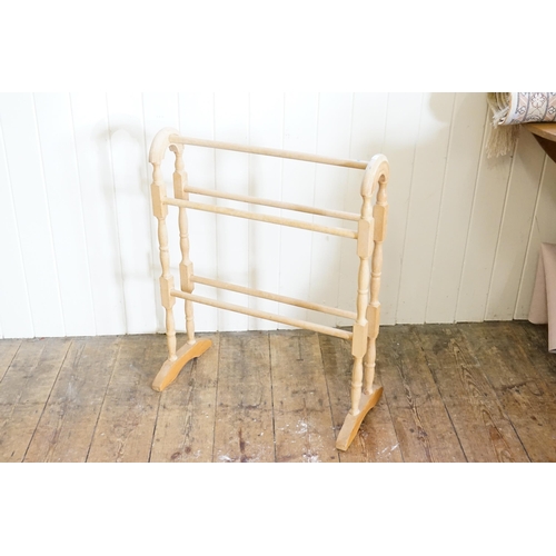 600 - A wooden towel rail.