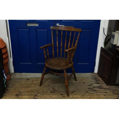 604 - An Elm Solid Seated Lathe turned Elbow Kitchen Chair with Crimoline Cross Stretcher & curved crestin... 