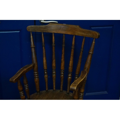 604 - An Elm Solid Seated Lathe turned Elbow Kitchen Chair with Crimoline Cross Stretcher & curved crestin... 