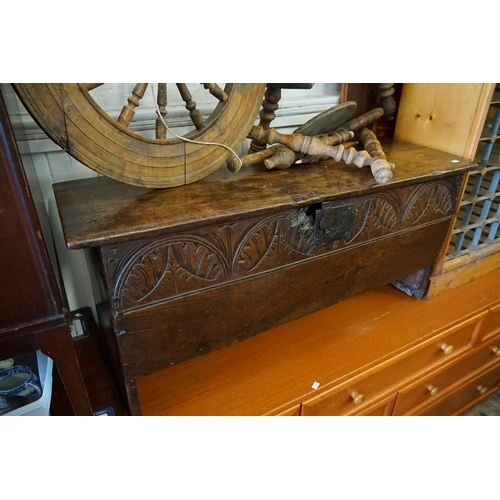 606 - An Antique Oak Four panelled Coffer with a half carved front. Measuring: 99cms across x 34cms deep x... 