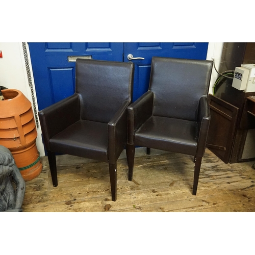 614 - Two Edge Stitched  Roll Over Armed Elbow Chairs resting on Square Legs.