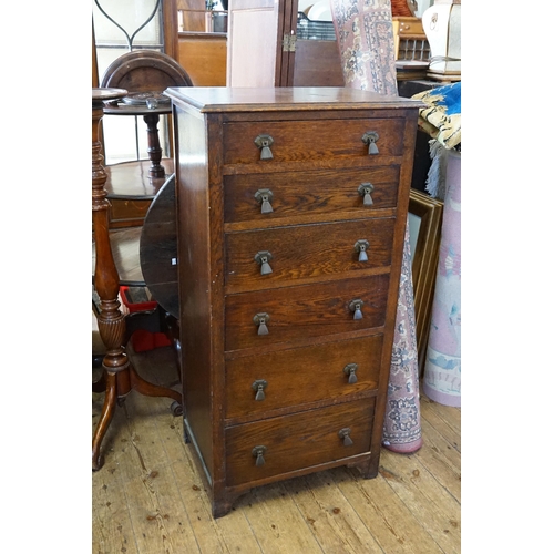 615 - A 1920s Oak Millinery Chest of Six Drawers. Measuring: 61cms across x 122cms high x 43cms deep.