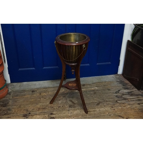 622 - A Mahogany & Shell inlaid Jardiniere Stand with Brass liner, Lion Ring Pull Handles & resting on a s... 