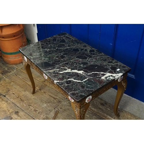 625 - A Serpentine Marble Topped Occasional Variegated Table. Measuring: 72cms x 44cms.