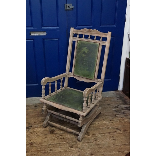 627 - An American Bleeched Walnut Framed Rocking Chair with Bulbous turnings & upholstered in Green.