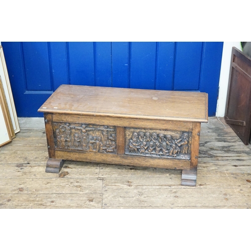 630 - A Carved Oak Fronted Lift-Top Coffer decorated with the Crucifixion, Jesus & his Disciples. Measurin... 