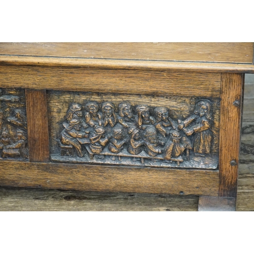 630 - A Carved Oak Fronted Lift-Top Coffer decorated with the Crucifixion, Jesus & his Disciples. Measurin... 