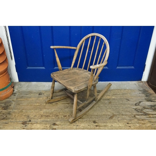 634 - A Wide Seated Low Down Rocking Chair with an elm seat.