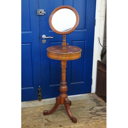 635 - A Victorian Circular Shaving Mirror with Swivelling Lift Up Containers resting on a turned wood base... 