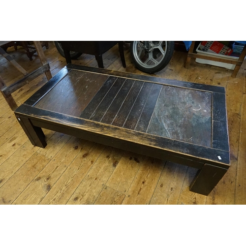 636 - A Japanese Low Down Dining Table with a Japanese inset Kigimi Stone Panels in an ebonised Oak Frame.