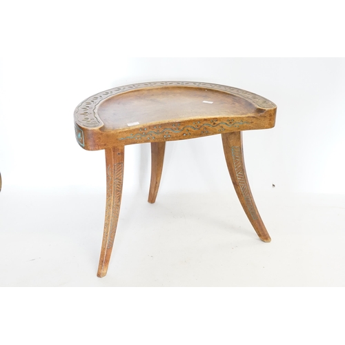 638 - An interesting 1920s Low Down Stool decorated with blue chip carving & resting on three legs, possib... 