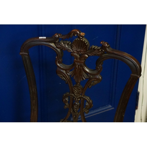 642 - A Pair of Mahogany Carved Back & Rococo pierced decoration Chairs resting on shaped legs & covered i... 