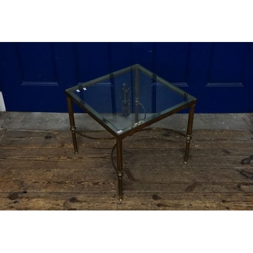 646 - A 1960s French design Gilt metal & glass topped Coffee Table after a design to Maison. Measuring: 46... 