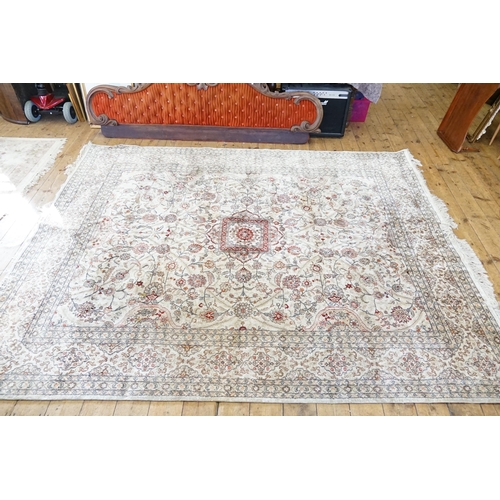 668 - A Beige Silk Carpet. Measures 245cm x 310cm.