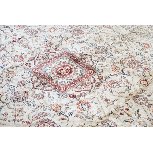 668 - A Beige Silk Carpet. Measures 245cm x 310cm.