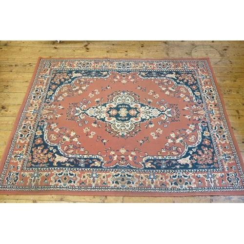 673 - An All Over Pink Ground Central Medallion Blue Cornered Rug. Measuring: 230cms x 170cms.