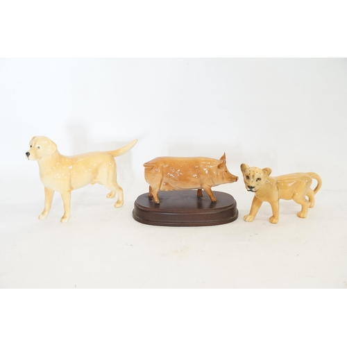 981 - A Beswick Study of a Cheetah, a Beswick Pig & a study of a pale tanned Labrador.