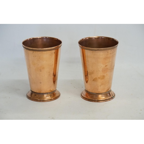 714 - A Pair of Copper Guild Beakers with stamped decoration.