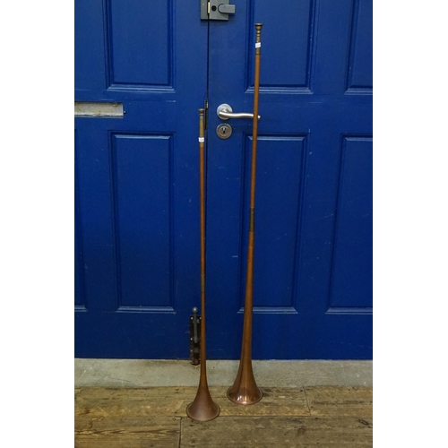 729 - Two Brass & Copper Hunting Horns. Measuring: 125cms & 100cms.