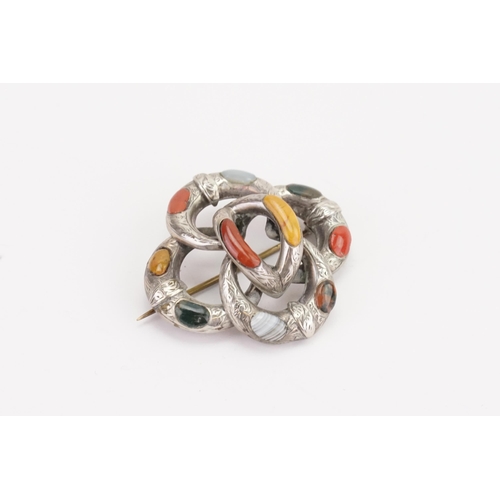 123 - A Scottish pebble brooch, set with various agates in the knot design, in a silver mount.